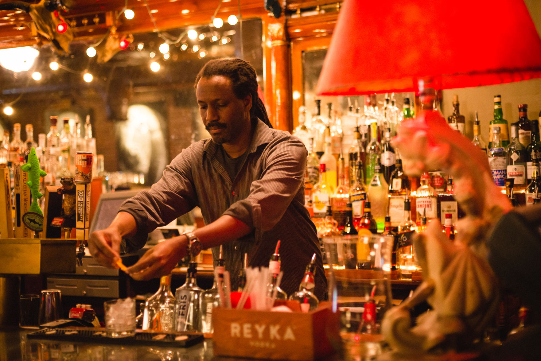 Opie Patterson, owner of Goat’s, mixes a Scarlett O’Hara
